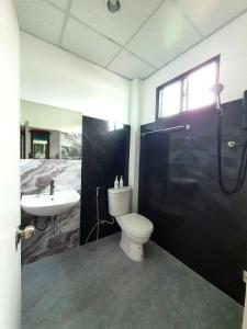 a bathroom with a toilet and a sink at Forge boutique in Chiang Mai +19 photos