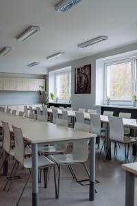 a conference room with a table and chairs at Hostel Guido in Zabrze