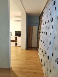 a hallway of a room with a wall with at Апартамент Централ in Targovishte
