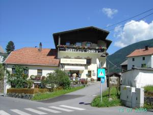 a building on the side of a street at Gasthaus Sonne in Wenns