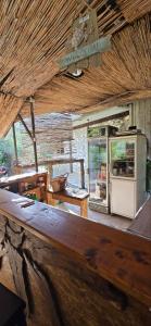 a kitchen with a counter and an oven in a building at My Olive Garden Camp in Bar