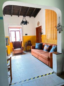 a living room with a couch and a chair at Solar Verbena in Vaiamonte