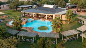 an aerial view of a resort with a swimming pool at The Kingdom Resort in Ledig