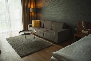 a living room with a couch and a table at Penzión Skalica in Skalica