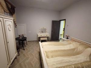 a bedroom with a bed and a tv in it at Мгер Мелконян in Tsaghkadzor