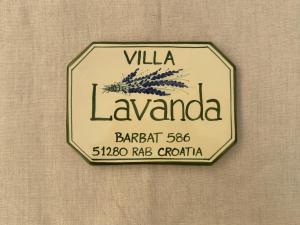 a sign on a wall that reads villa la at Rab Barbat Villas 4 stars 300 sea in Barbat na Rabu
