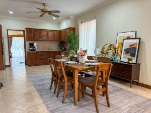 a kitchen and dining room with a table and chairs at View Talay Longstay Hotel & Suites in Jomtien Beach