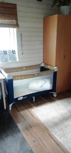 a bed in the corner of a room at Leia Kodu Private Garden House with Terrace & Parking in Rakvere in Rakvere +9 photos