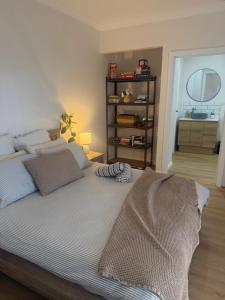 a bedroom with a bed with a blanket on it at Lamington Guesthouse in Kalgoorlie