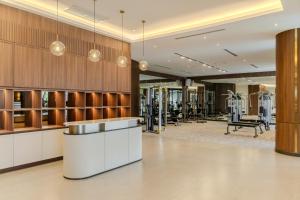a gym with treadmills and exercise equipment at A-ONE Bangkok Hotel in Bangkok