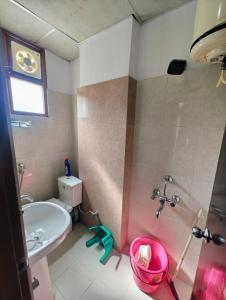a bathroom with a sink and a shower at 2BHK Flat in Bhimtal in Bhowāli