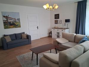 a living room with a couch and a table at Orlik in Spišské Bystré