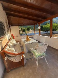 a patio with a table and chairs on a balcony at All seasons Mountain escape in Vília