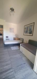 a bedroom with two beds in a room at CASA VACANZE Matilde in Gavirate