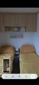 two beds sitting next to each other in a room at The Joanack Breeze in Withernsea