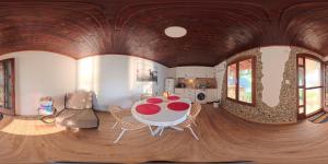 a room with a table and chairs in a house at Vila Hedona in Donji Milanovac +16 photos