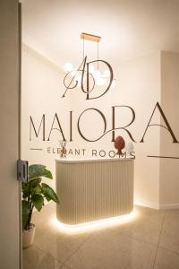 a sign for the maroon elephant room at the maroon elephant room at Ad Maiora Elegant Rooms in Palermo