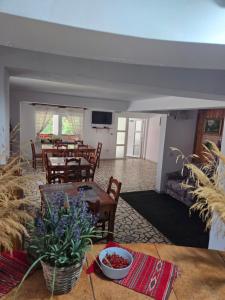 a living room with a table and a couch at Pensiunea Flora TransFăgărășan in Cumpăna +46 photos