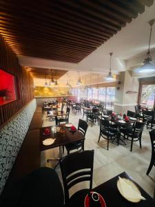 a dining room with tables and chairs in a restaurant at Innscape Classic Hotel in Cape Town +17 photos