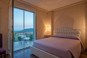 Postel nebo postele na pokoji v ubytování Collina Degli Ulivi B&B