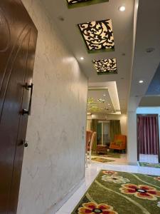 a lobby with a door and a room at See side view city square 42 in Alexandria