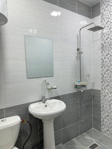 a bathroom with a sink and a shower at Ситора in Dushanbe
