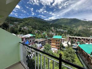 a view of a city from a balcony at Backpacker Inn Mcleod in Dharmsāla