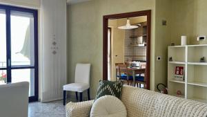 a living room with a couch and a table at Casa Ada in Termoli
