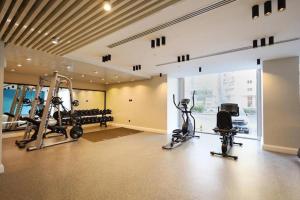 a gym with treadmills and exercise equipment in a building at شقه دار المشاعر فى دار الاركان لشقق لاكجرى in Mecca