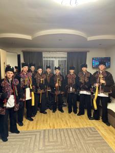 a group of people in uniform posing for a picture at Fetal Hut - Плідна Хата in Verkhovyna