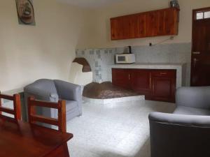a living room with a couch and a fireplace at Capri Hills 9 in Mwanza