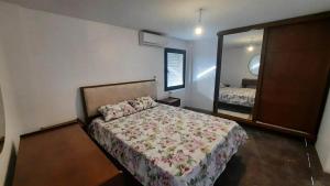a bedroom with a bed and a large mirror at Prestigieux appartement in Hammam Sousse +2 photos