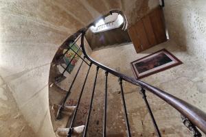 an overhead view of a spiral staircase in a building at B&B Le Miroir aux Fées Bordeaux in Bordeaux