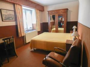 Postel nebo postele na pokoji v ubytování Hôtel du Fort
