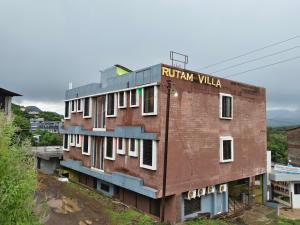 a brick building with the words roman villa on it at Rutam villa in Shendi