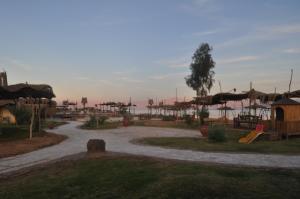 a park with a playground with a slide at Sayadeen Village - Red Sea Riviera in Nuweiba