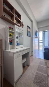 a room with a white desk in a room at Eve's Condo in Cagayan de Oro