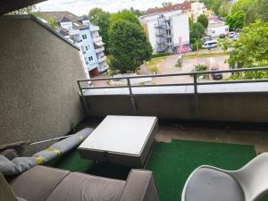 a view of a balcony with a table and chairs at Bochum Wohnung in Bochum