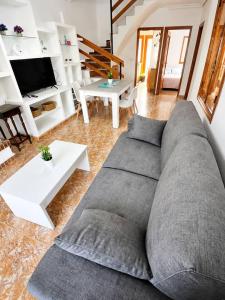 a living room with a couch and a table at Villa Belén . in El Moncayo