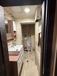 a small bathroom with a sink and a toilet at Етаж от къща в Разград in Razgrad