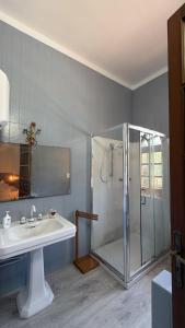 a bathroom with a shower and a sink and a shower at nonnacampagna in Bari