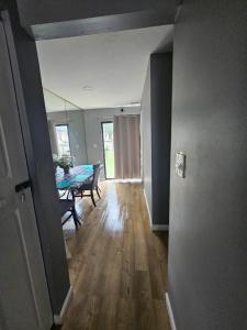 an empty room with a table and a dining room at Cozy place! in Baltimore