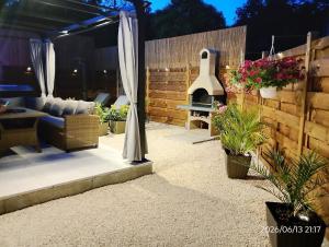 a patio with a couch and a fire place at Dalmatian Stone House Angela in Drniš +61 photos