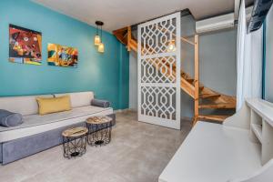 a living room with a couch and a bunk bed at Armeno Resort in Marathias +61 photos
