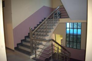 a spiral staircase in a building with a window at Hotel Harsh Garden in Varanasi