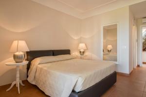 Postel nebo postele na pokoji v ubytování Collina Degli Ulivi B&B