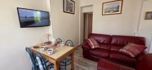 a living room with a couch and a table at Villa Jamgers in Martigues