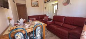 a living room with a couch and a table at Villa Jamgers in Martigues