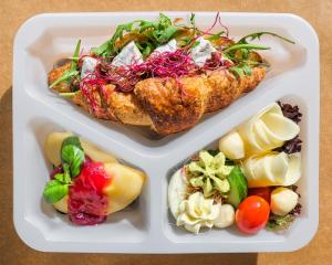two plastic containers filled with food and vegetables at Apres Ski Bachleda in Zakopane