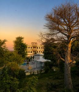 a building with a pond in front of it at Castle Bijaipur - A Luxury Heritage Resort, Chittorgarh in Bijaipur +68 photos
